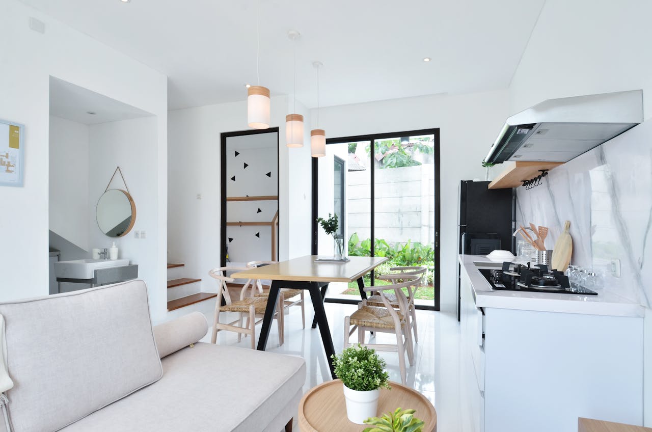 Bright and spacious modern kitchen and dining area showcasing minimalism and functionality.